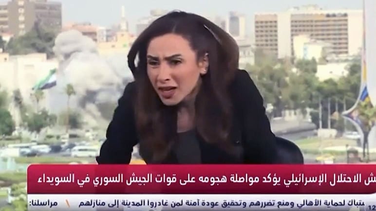 Anchor takes cover live on air after Israeli strike on Syrian capital