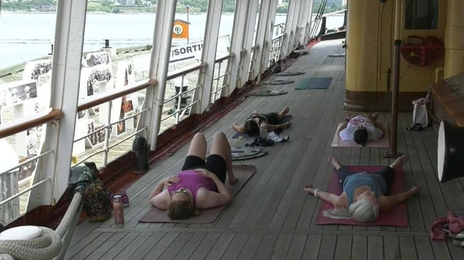 Yogis on deck for sea salutations