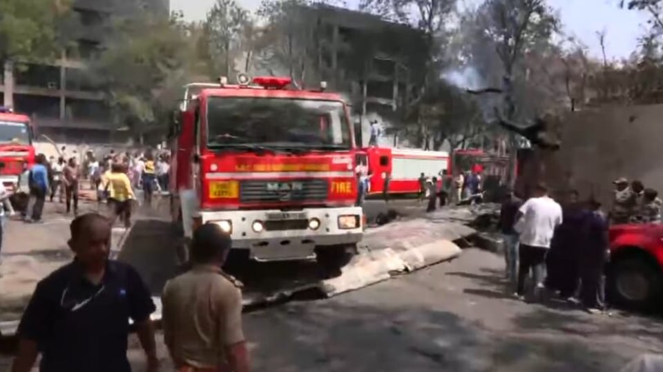 Emergency crews at the scene of Air India plane crash in Ahmedabad