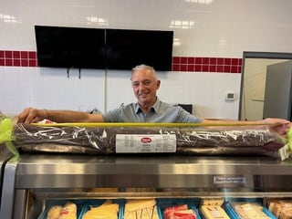 Turning a massive salami into hundreds of sandwiches for the homeless